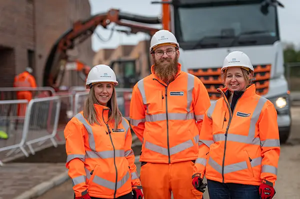 YTL Construction employees standing in front of a lorry